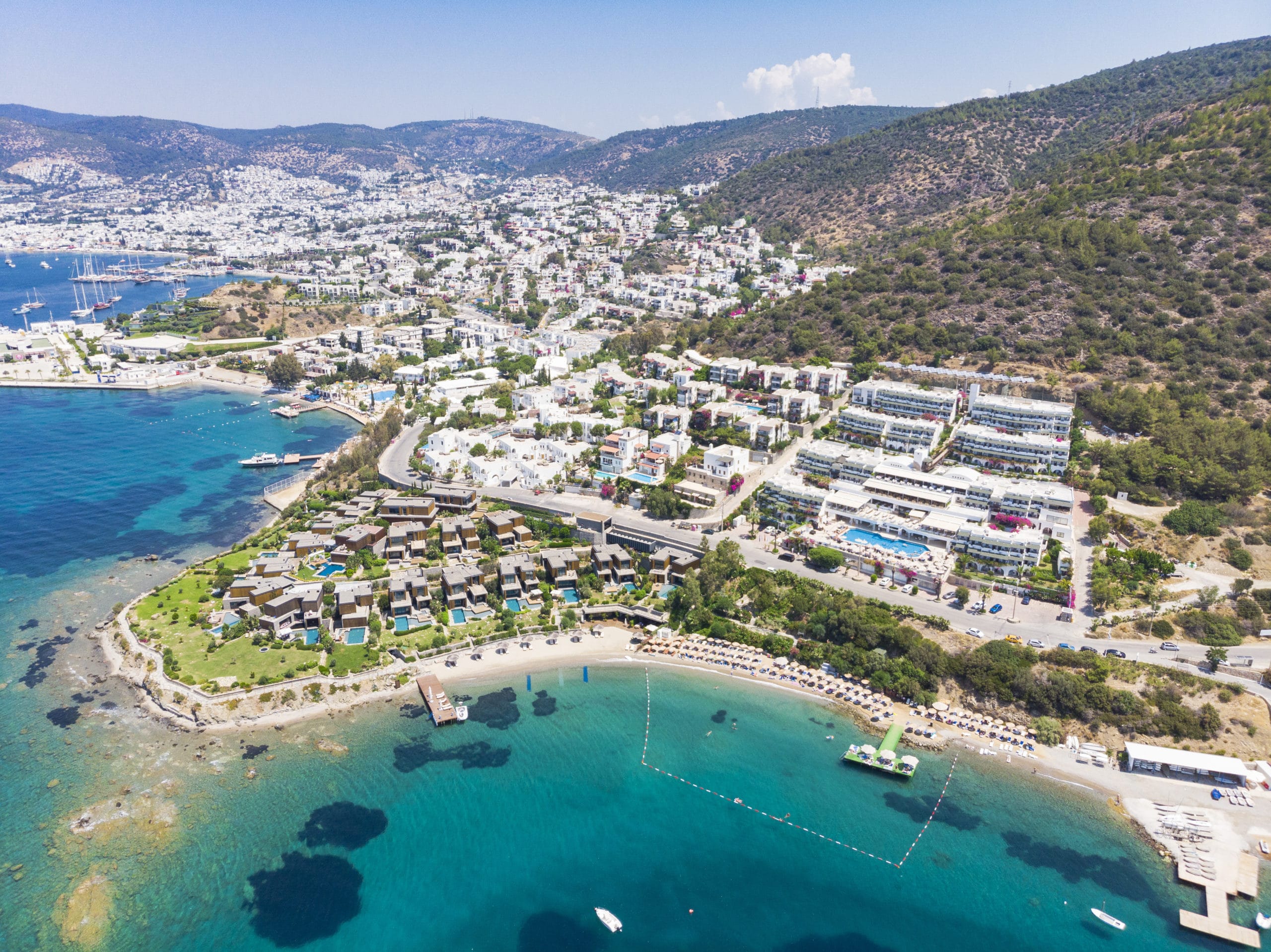 aerial view of sunny bodrum with resorts and beachfront villas