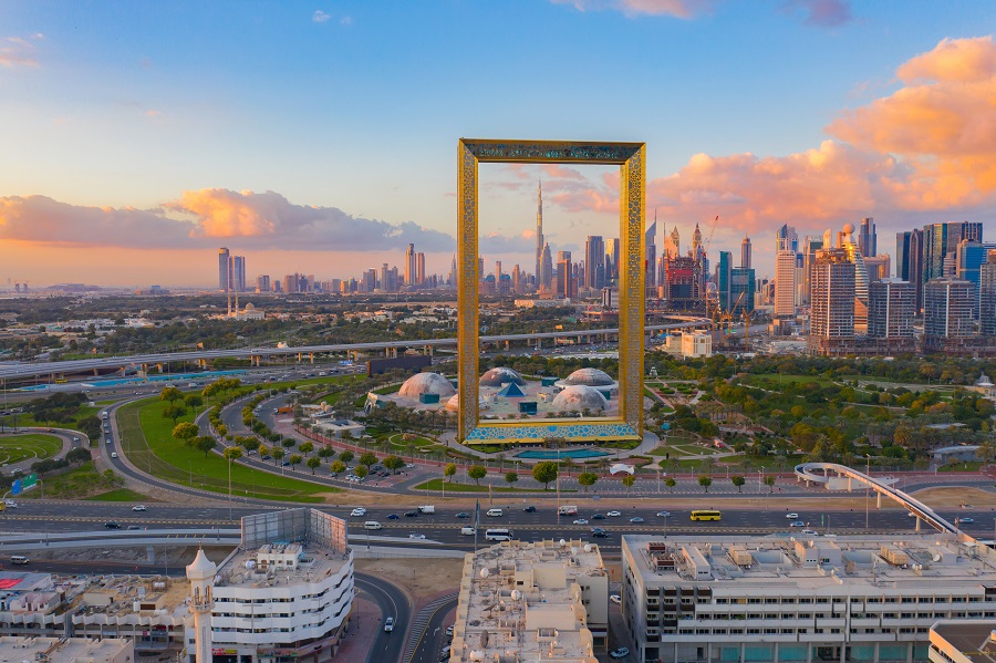 aerial view of dubai frame, downtown skyline, united arab emirates or uae. financial district and business area in smart urban city. skyscraper and high rise buildings at sunset.