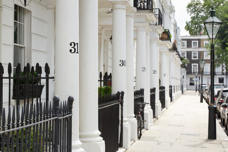 row of beautiful white edwardian houses in kensington, london