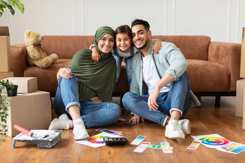 happy muslim family doing repair in new house